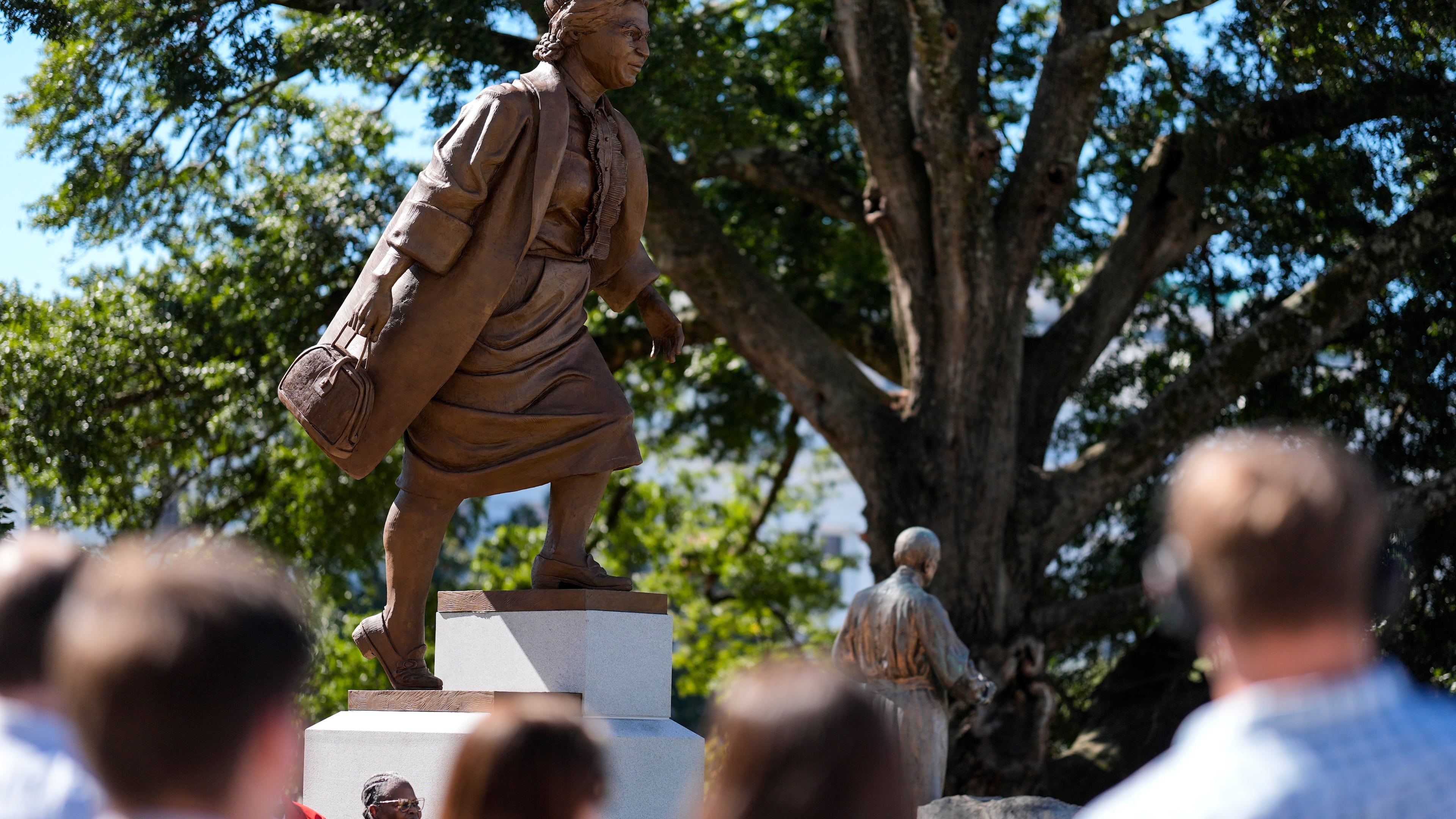 People view a newly unveiled statue of Rosa Parks on the grounds of the Alabama State Capitol, Friday, Oct. 24, 2025, in Montgomery, Ala. (AP Photo/Mike Stewart)