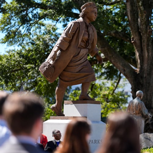 People view a newly unveiled statue of Rosa Parks on the grounds of the Alabama State Capitol, Friday, Oct. 24, 2025, in Montgomery, Ala. (AP Photo/Mike Stewart)