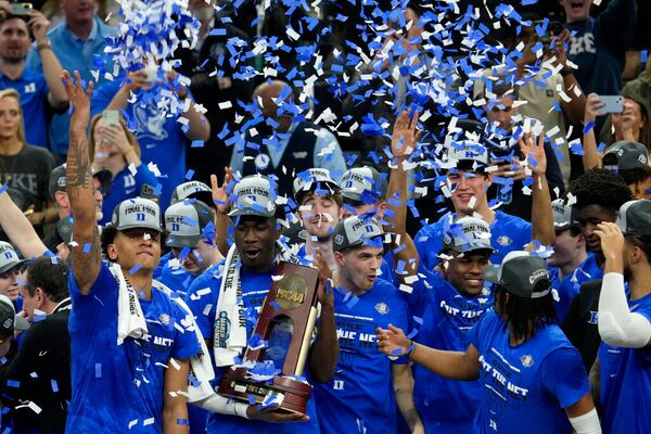 Duke players celebrate after defeating Arkansas in a college basketball game in the Elite 8 round of the NCAA men's tournament in San Francisco, Saturday, March 26, 2022. (AP Photo/Tony Avelar)