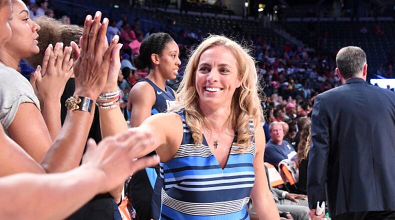Dream coach Nicki Collen accepts the congratulations of her fans. (Scott Cunningham/NBAE via Getty Images)