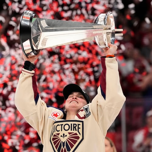Montreal Victoire's Marie-Philip Poulin (29) raises the PWHL Walter Cup after the team's win against the Ottawa Charge, in Ottawa, on Wednesday, May 20, 2026. (Adrian Wyld/The Canadian Press via AP)