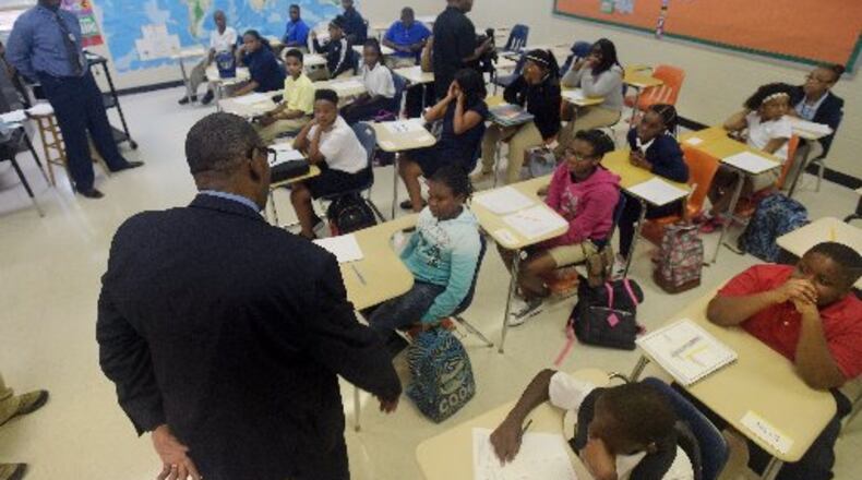 DeKalb County School District Superintendent Steve Green visits with students at Chapel Hill Middle School on the first day of school in 2015. AJC FILE PHOTO