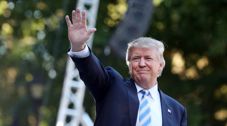Donald Trump waves to the crowd after finishing his speech at a campaign stop at Regent University in Virginia Beach, Va., on Saturday, Oct. 22, 2016. (Steve Earley/The Virginian-Pilot via AP)