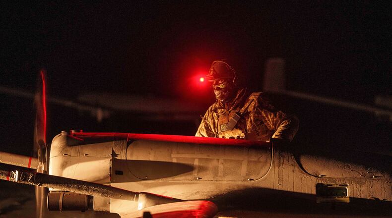 FILE - A Ukrainian serviceman of the 14th Separate Unmanned Aerial Systems Regiment prepares a long-range drone An-196 Liutyi before takeoff in undisclosed location, Ukraine, Tuesday, Oct. 14, 2025. (AP Photo/Evgeniy Maloletka, File)