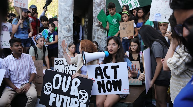 Youth led protesters demonstrate in front of the United Nations (UN) in support of measures to stop climate change during a weekly Friday gathering on August 30, 2019 in New York City. In Atlanta, students will strike outside of the state capitol on Friday, Sept. 20 and 27. (Photo by Spencer Platt/Getty Images)