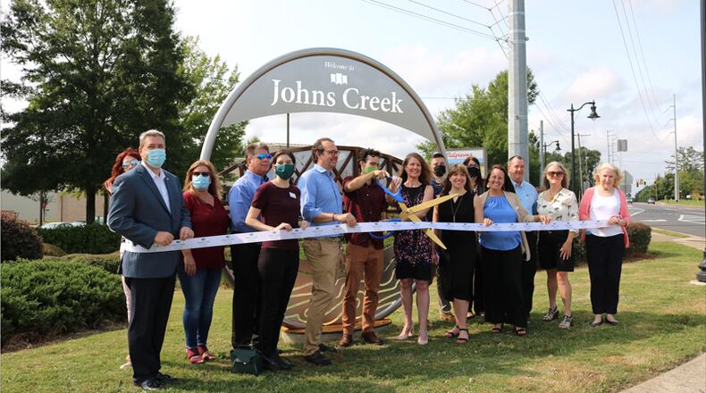 Officials of Johns Creek and its Convention and Visitors Bureau dedicate the city's first gateway marker, on Kimball Bridge Road, in September 2020. In January 2020, CVB Attorney Monica Gilroy said the nonprofit will consider filling an ethics complaint against Councilwomen Stephanie Endres and Erin Elwood unless they apologize for threatening actions.