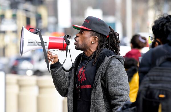 Augustus Romain Jr. protests outside the CNN building in Atlanta in 2022. (Daniel Varnado/AJC)