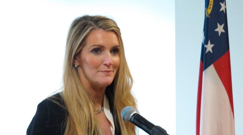 Republican businesswoman Kelly Loeffler, who will soon be Georgia's next U.S. senator, speaks to reporters at the Port of Savannah on Thursday, Jan. 2, 2020, in Savannah, Georgia. Loeffler is scheduled to be sworn in when the Senate convenes Monday, Jan. 6 in Washington. She was chosen by Gov. Brian Kemp to fill the seat of GOP Sen. Johnny Isakson, who left office at the end of 2019 because of health problems. (AP Photo/Russ Bynum)