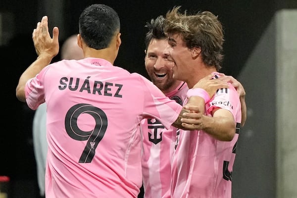 Inter Miami's Lionel Messi, center, celebrates after scoring his side's second goal during the Club World Cup group A soccer match between Inter Miami and FC Porto in Atlanta, Thursday, June 19, 2025. (AP Photo/Brynn Anderson)