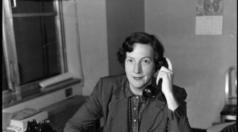 Atlanta Constitution columnist Celestine Sibley at her desk. (1957)