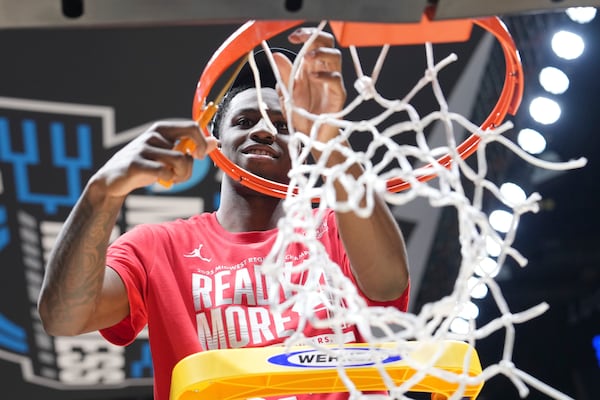 Houston's Terrance Arceneaux cuts down the net following his team's victory over Tennessee in the Elite Eight round of the NCAA college basketball tournament Sunday, March 30, 2025, in Indianapolis. (AP Photo/AJ Mast)