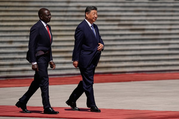 Chinese President Xi Jinping, right, and Kenyan President William Ruto attend a welcome ceremony at the Great Hall of the People Thursday, April 24, 2025 in Beijing, China. (Iori Sagisawa/Pool Photo via AP)