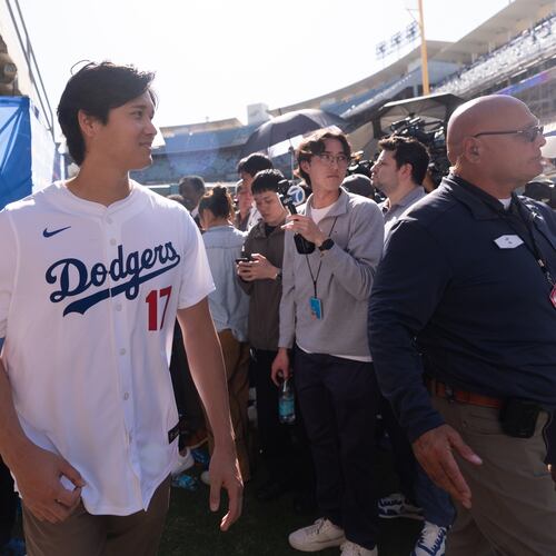 Los Angeles Dodgers two-way player Shohei Ohtani leaves after talking to reporters during DodgerFest at Dodger Stadium in Los Angeles, Saturday, Jan. 31, 2026. (AP Photo/Jae C. Hong)