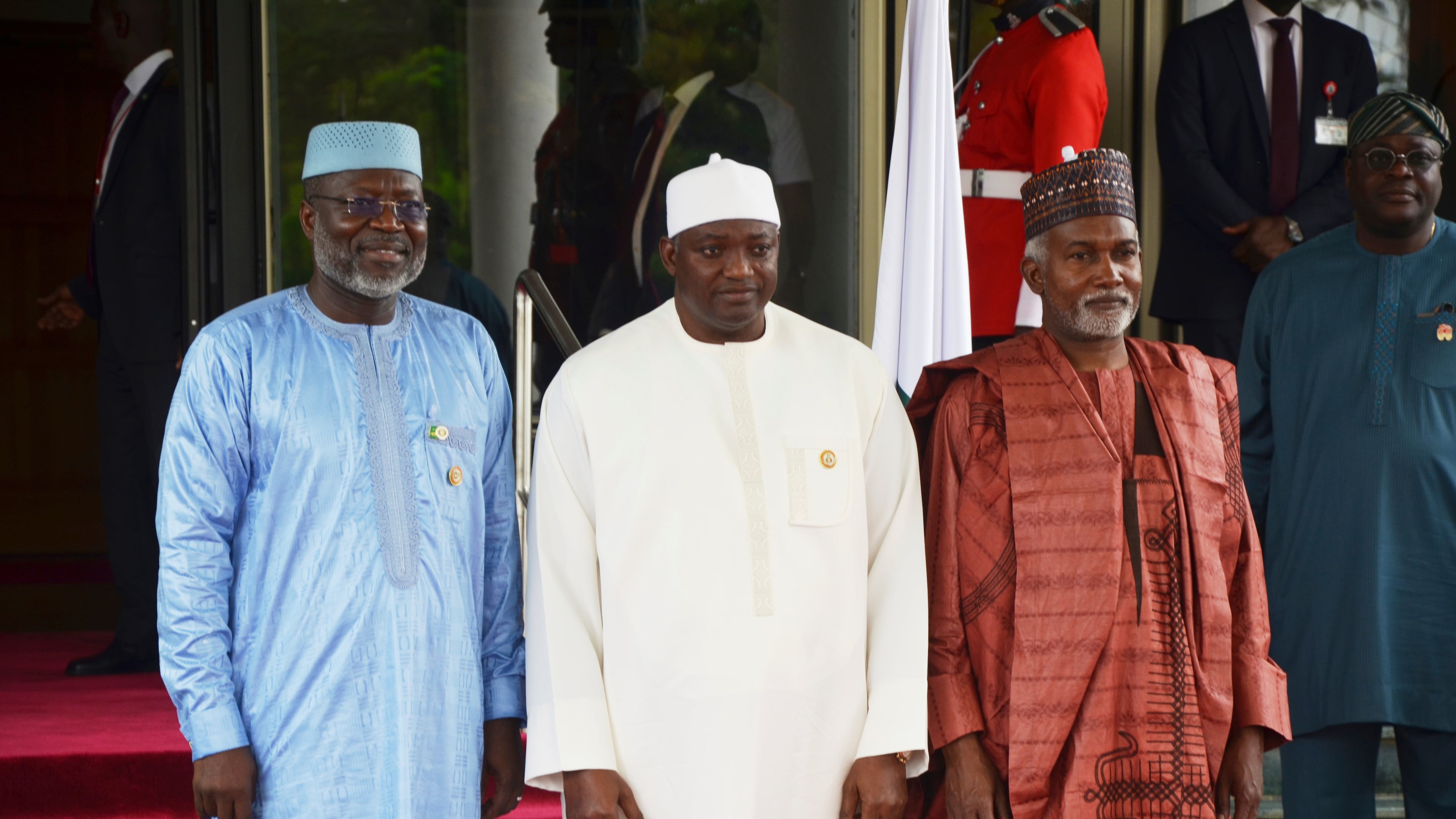 FILE - Omar Touray, president of the ECOWAS Commission, left, Gambia's President Adama Barrow,, center and Nigeria Minister of Foreign Affairs, Yusuf Tuggar pose for a photo, prior to the start of the ECOWAS meeting in Abuja, Nigeria, Sunday, June 22, 2025. (AP Photo/Olamikan Gbemiga, file)