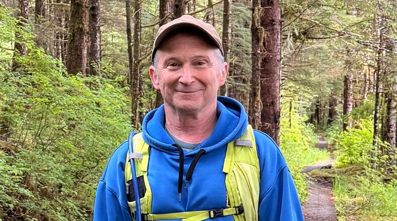 In this image provided by Karen Dillman, Alaska Senate candidate Dan Sullivan, one of the challengers to the incumbent senator, also named Dan Sullivan, poses for a photo on a hike, Sunday, June 7, 2026, on Kupreanof Island, near Petersburg, Alaska. (Karen Dillman via AP)