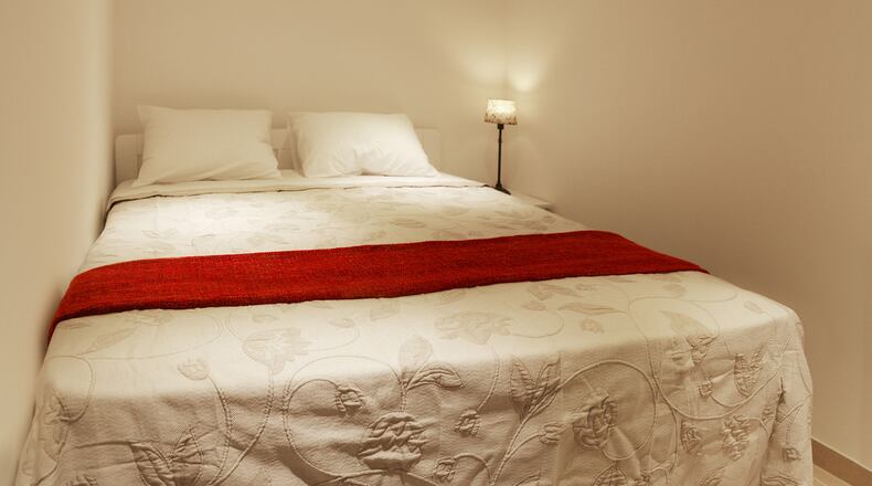 Want to get that plush hotel look? Try going all white: walls, ceiling, floors, furniture, and, most importantly, bedding. (Dreamstime)