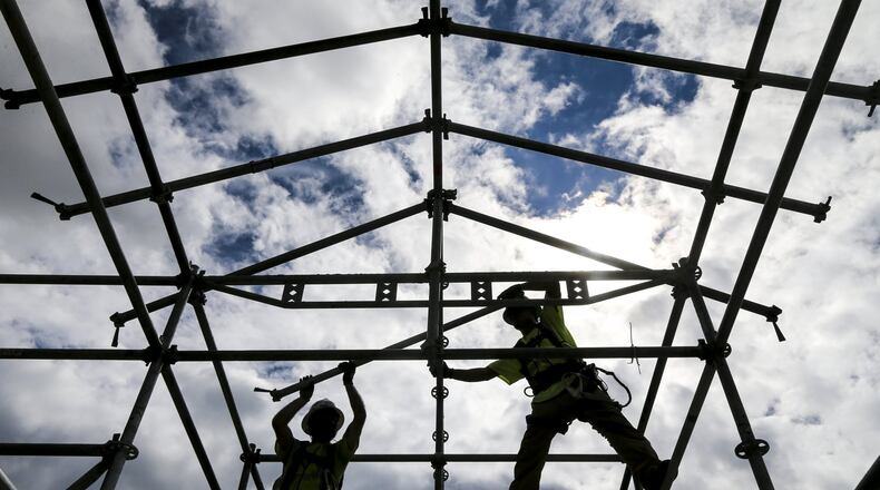 August 11, 2017 construction of a temporary sidewalk covering on the North Terminal as Hartsfield-Jackson International Airport is preparing for the construction of massive canopies over the domestic terminal curbside pickup and drop-off areas. JOHN SPINK/JSPINK@AJC.COM