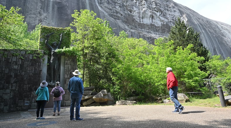 April 20, 2021 Stone Mountain - Park goers walk around Valor Park were Statue of Valor is located at Stone Mountain Park on Tuesday, April 20, 2021. (Hyosub Shin / Hyosub.Shin@ajc.com)