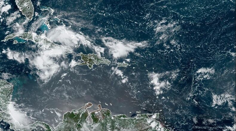 A satellite image captured on Friday, August 2, 2024, shows "Potential Tropical Cyclone Four" in the Caribbean Sea. The storm could bring damaging winds, rain and flooding to Florida and other parts of the Southeast.