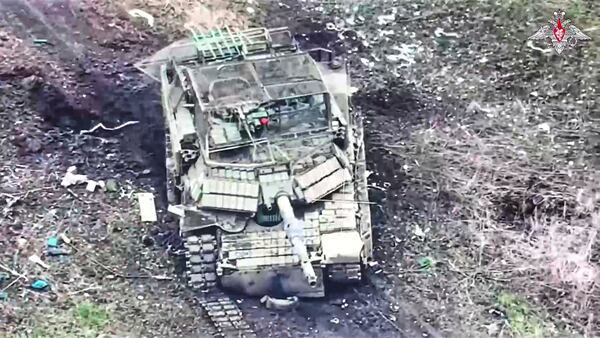 In this photo taken from video distributed by Russian Defense Ministry Press Service on Tuesday, April 8, 2025, A destroyed U.S.-made M1 Abrams tank of Ukrainian Army is seen at an undisclosed location in Ukraine. (Russian Defense Ministry Press Service via AP)