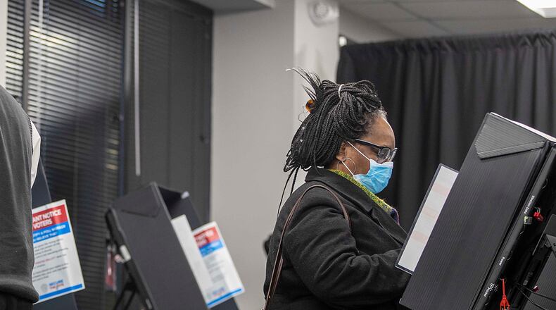 12/14/2020 —  Marietta, Georgia — Cobb County residents cast their ballots during early voting at the Cobb County Elections and Voter Registration Office in Marietta, Monday, December 14, 2020.  (Alyssa Pointer / Alyssa.Pointer@ajc.com)