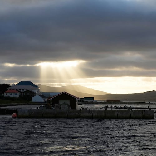 FILE - Sunlight breaks through the clouds over Stanley on the Falkland Islands, also known as Islas Malvinas, March 14, 2026. (AP Photo/Ricardo Mazalan, File)