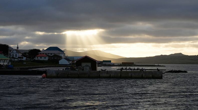 FILE - Sunlight breaks through the clouds over Stanley on the Falkland Islands, also known as Islas Malvinas, March 14, 2026. (AP Photo/Ricardo Mazalan, File)