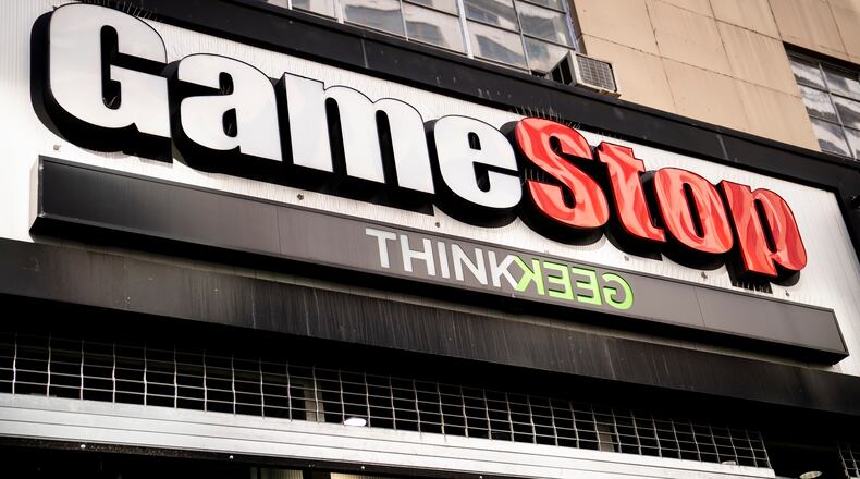 FILE - Pedestrians pass a GameStop store on 14th Street at Union Square, Thursday, Jan. 28, 2021, in the Manhattan borough of New York. (AP Photo/John Minchillo, File)