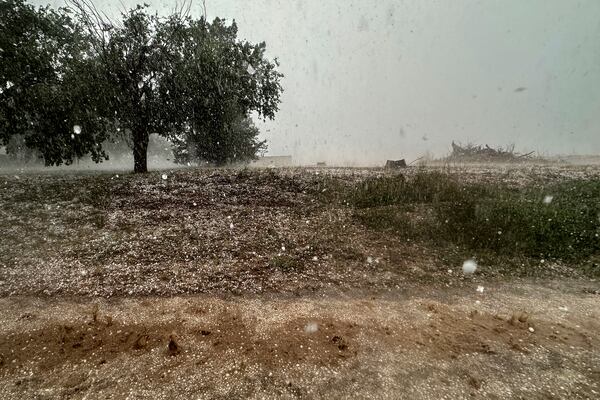 A hailstorm is visible from Northern Illinois University's Husky Hail Hunter vehicle during a Project ICECHIP operation Friday, June 6, 2025, in Levelland, Texas. (AP Photo/Carolyn Kaster)