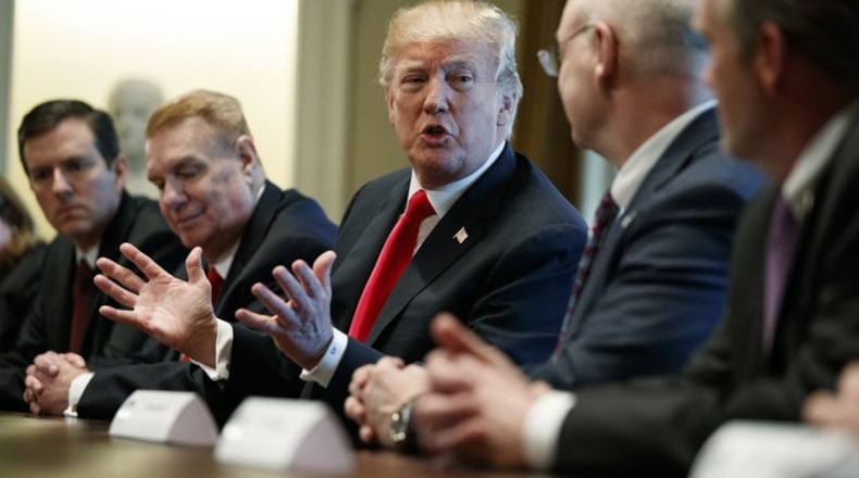 President Donald Trump speaks during a meeting with steel and aluminum executives in the Cabinet Room of the White House, Thursday. (AP Photo / Evan Vucci)