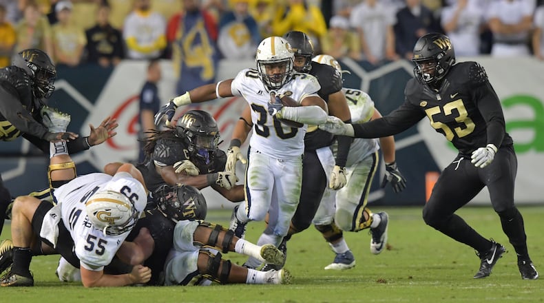 October 21, 2017 Atlanta - Georgia Tech running back KirVonte Benson (30) runs with the ball in the first half of an NCAA college football game at Bobby Dodd Stadium on Saturday, October 21, 2017. HYOSUB SHIN / HSHIN@AJC.COM