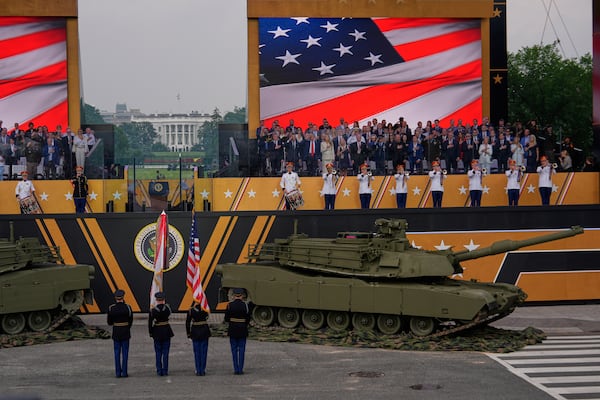 The National Anthem is performed as President Donald Trump attends a military parade commemorating the Army's 250th anniversary, coinciding with his 79th birthday, Saturday, June 14, 2025, in Washington. (AP Photo/Julia Demaree Nikhinson)