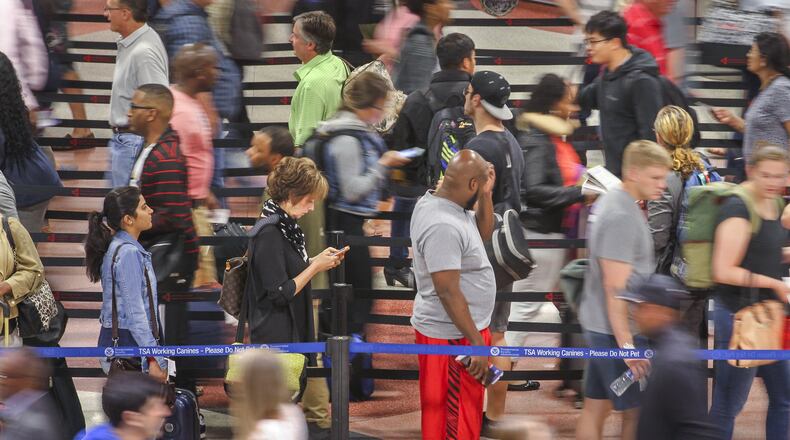 Security lines were excruciatingly long at Hartsfield-Jackson International Airport as the Memorial Day weekend commenced. JOHN SPINK / JSPINK@AJC.COM