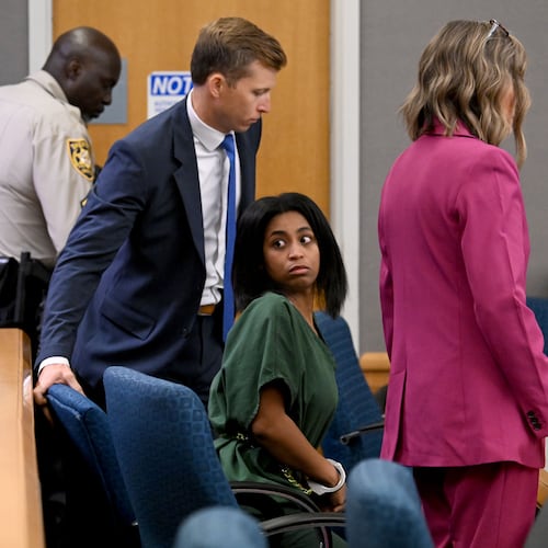 Deja Coleman, who is charged in the death of her 1-year-old son after officials said he was left in a hot car, in the courtroom during a bond hearing before a Gwinnett County Superior Court judge on Wednesday, Sept. 9, 2026. Coleman is charged with second-degree murder and second-degree cruelty to children and was granted bond Wednesday. (Hyosub Shin/AJC)