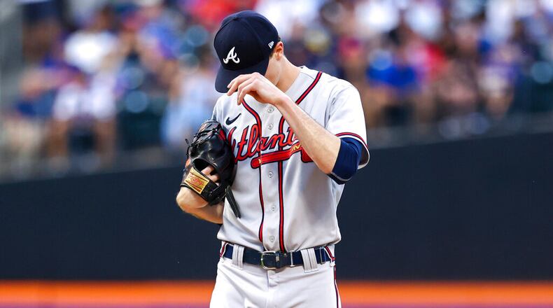 Braves starting pitcher Max Fried adjusts his cap while facing the Mets on Saturday in New York. (AP Photo/Jessie Alcheh)