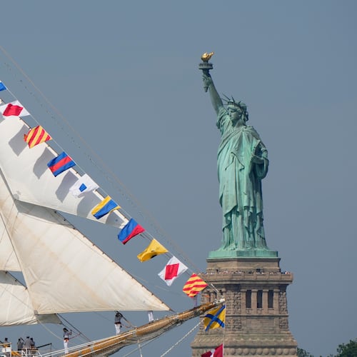 The Statue of Liberty is seen as Argentina's Ara Libertad sails past in the New York harbor during the International Parade of Sail, part of Sail250, a gathering of tall ships and military ships, Saturday, July 4, 2026, in New York. (AP Photo/Yuki Iwamura)