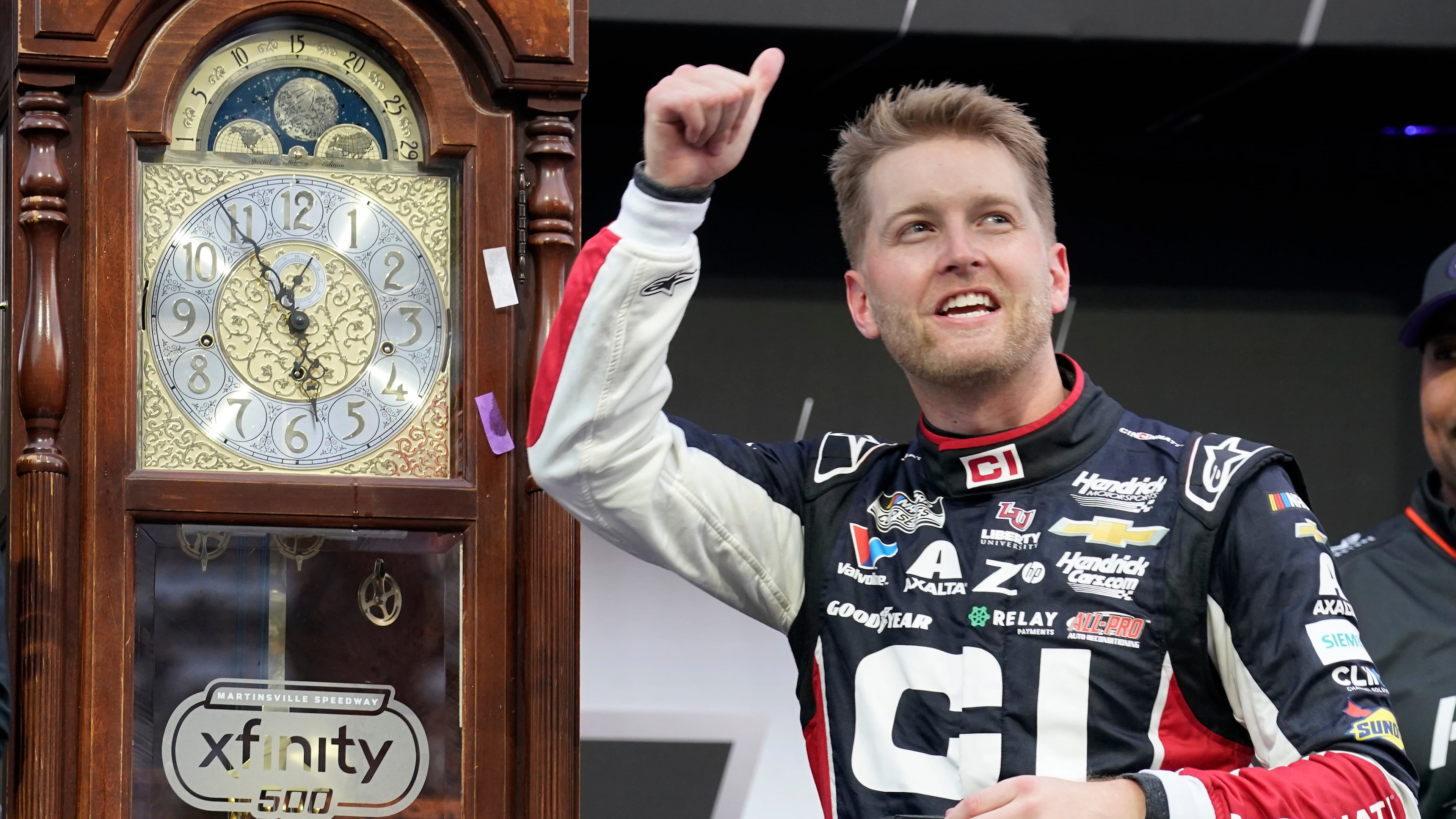 William Byron celebrates in Victory Lane after winning a NASCAR Cup series auto race in Martinsville, Va., Sunday, Oct. 26, 2025. (AP Photo/Chuck Burton)