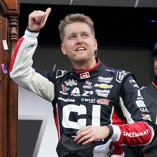 William Byron celebrates in Victory Lane after winning a NASCAR Cup series auto race in Martinsville, Va., Sunday, Oct. 26, 2025. (AP Photo/Chuck Burton)