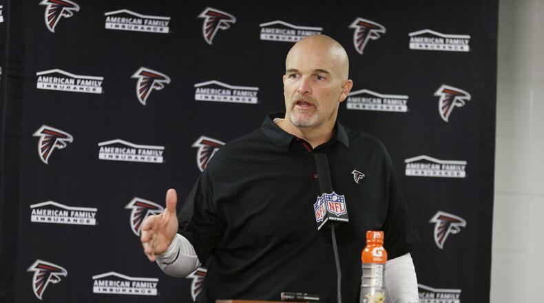 Atlanta Falcons head coach Dan Quinn talks to reporters during a news conference after an NFL football game against the Chicago Bears, Sunday, Sept. 10, 2017, in Chicago. (AP Photo/Michael Conroy)
