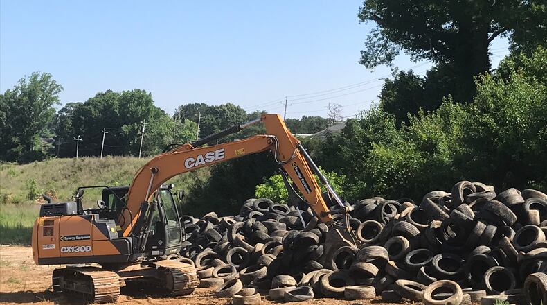 About 2,000 tires have been removed from a tract of land owned by Blackhall Studios, but there is more illegal dumping to be cleaned on the site that is part of a land swap proposal with DeKalb County.