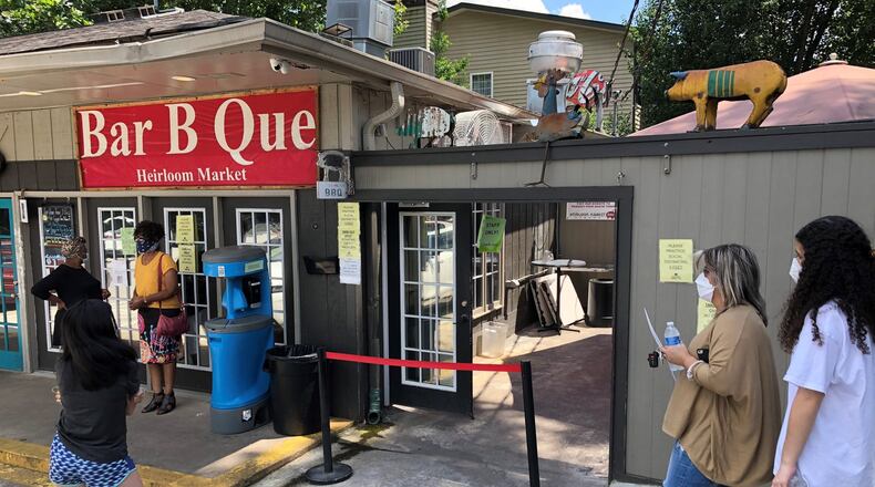 Customers wait outside for takeout at Heirloom Market BBQ. Contributed by Wendell Brock