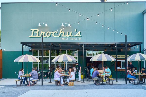 The patio at Brochu's Family Tradition offers dining on umbrella-covered picnic tables. While the dining room requires reservations, the patio and bar are first come, first served.  / Photo by John Park