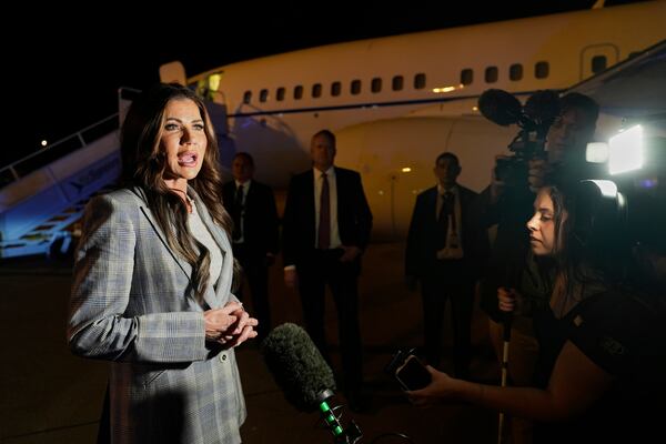 Homeland Security Secretary Kristi Noem takes questions from the press before boarding her plane at Comalapa International Airport in San Salvador, El Salvador, Wednesday, March 26, 2025. (AP Photo/Alex Brandon)