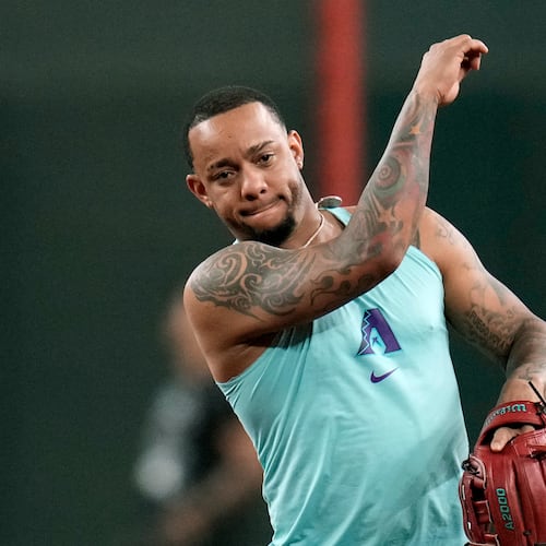 Returning Arizona Diamondbacks' Ketel Marte throws during infield practice prior to a baseball game against the Philadelphia Phillies, Monday, Aug. 31, 2026, in Phoenix. (AP Photo/Ross D. Franklin)