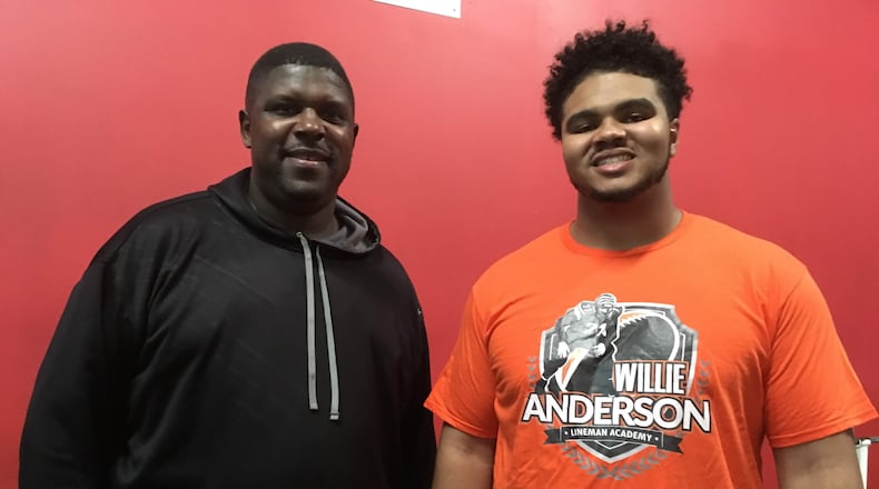Three-time first-team NFL All-Pro Willie Anderson (left), with Georgia Tech offensive tackle Jared Southers, is optimistic about the potential for the Yellow Jackets offensive linemen to transition to a spread offense. (AJC photo by Ken Sugiura)
