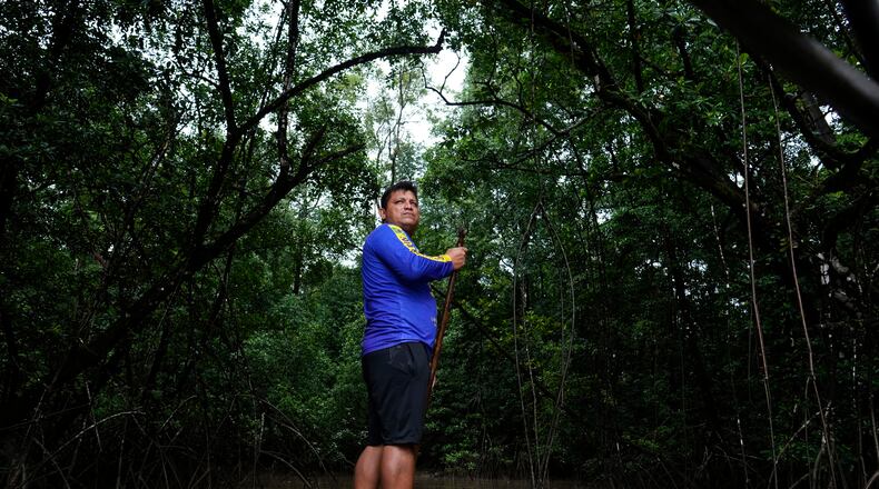 Edervan Forte dos Santos, from the Galibi Kali'na community, steers his boat toward mangroves in the biodiversity conservation area of Cabo Orange, in Oiapoque, Amapa state, Brazil, Thursday, March 12, 2026. (AP Photo/Eraldo Peres)