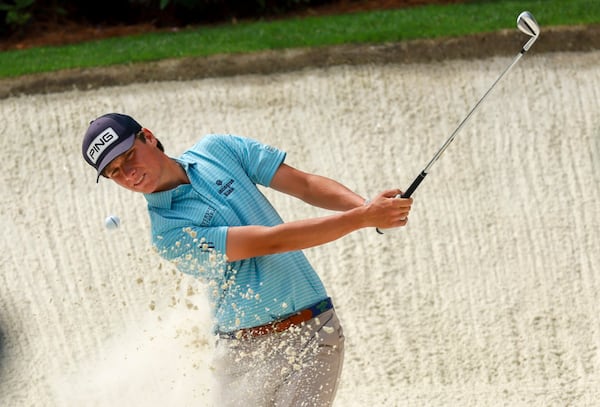 Amateur Mason Howell hits out of a bunker on the 13th green during a practice round at the Masters golf tournament, Tuesday, April 7, 2026, in Augusta, Ga. (Jason Getz/AJC) 