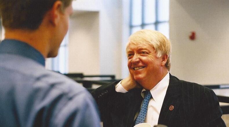 Then-University of Georgia President Michael Adams speaks with Greg Bluestein at the Athens headquarters of The Red & Black student newspaper in 2003. (Provided by Greg Bluestein)