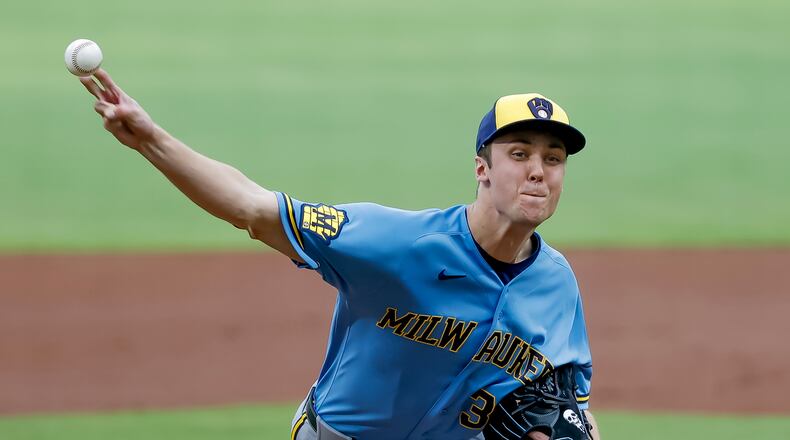 Milwaukee Brewers pitcher Jacob Misiorowski, right, delivers a pitch to Atlanta Braves' Matt Olson during the first inning of a baseball game, Friday, June 19, 2026, in Atlanta. (AP Photo/Erik S. Lesser)