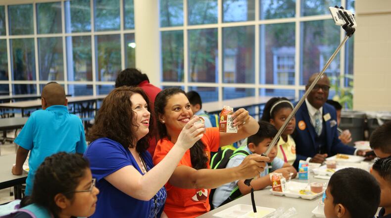 Stacey Abbott, principal of Garden Hills Elementary School, and Meria Carstarphen, Atlanta Public Schools Superintendent, take a selfie while eating breakfast with students.